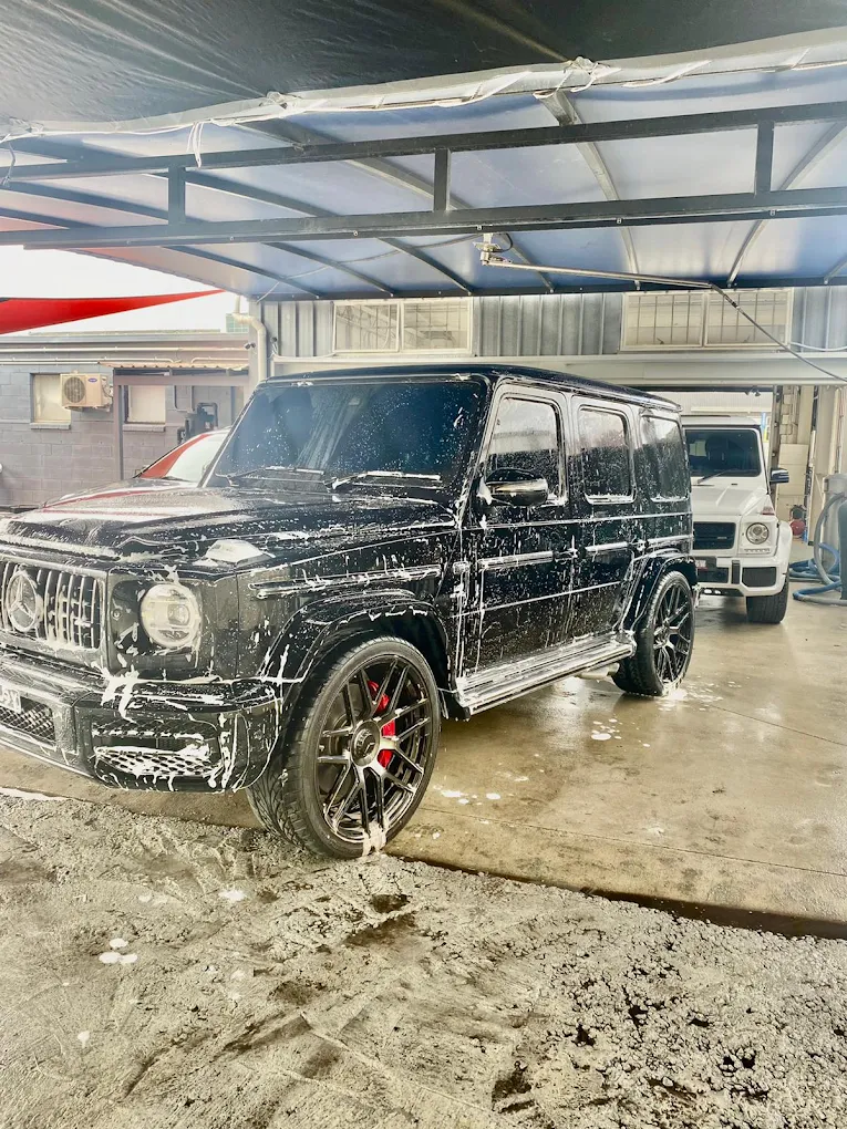 Black Mercedes G-Wagon being hand washed
