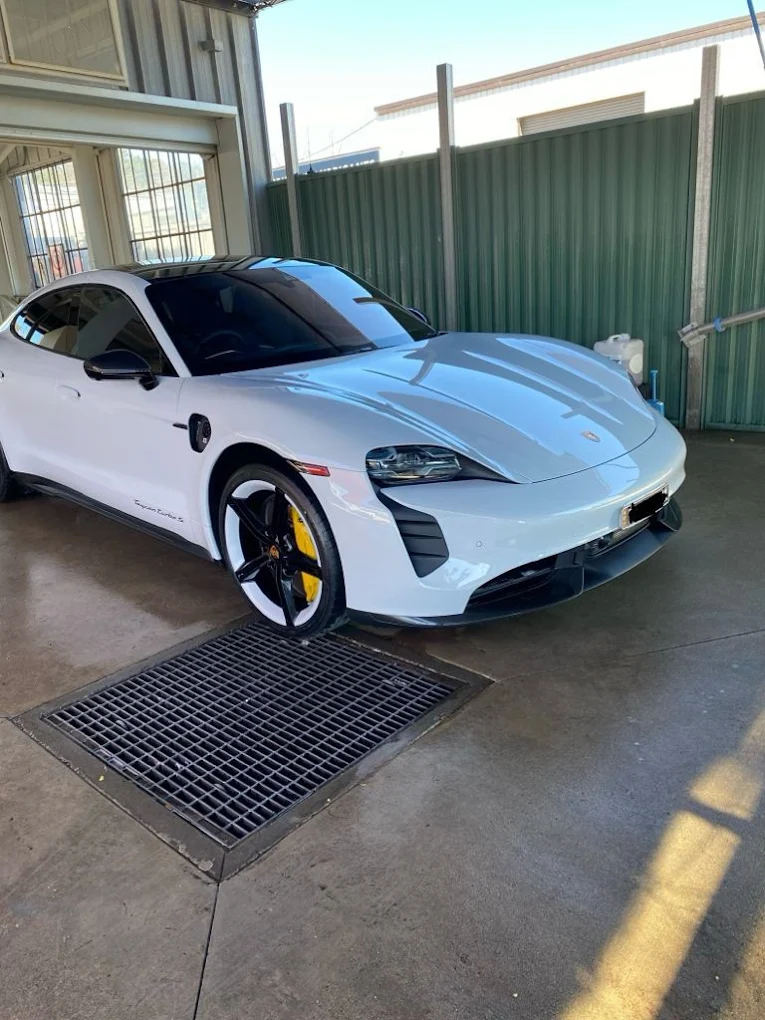White Porsche Taycan Turbo S freshly washed